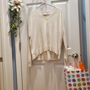 Athleta Cream Sweater, size Small, V neck, short-long hem.